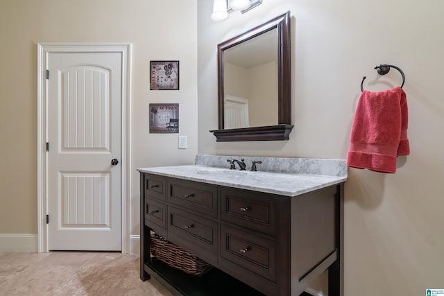 bathroom with vanity and tile patterned flooring