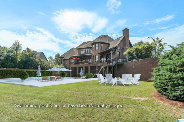 back of property with a patio and a lawn