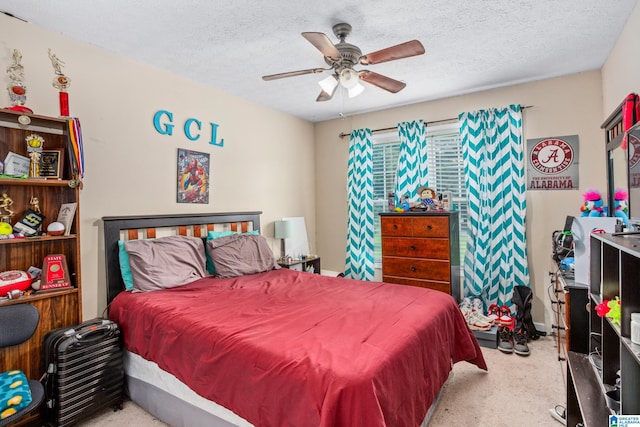bedroom featuring ceiling fan and a textured ceiling