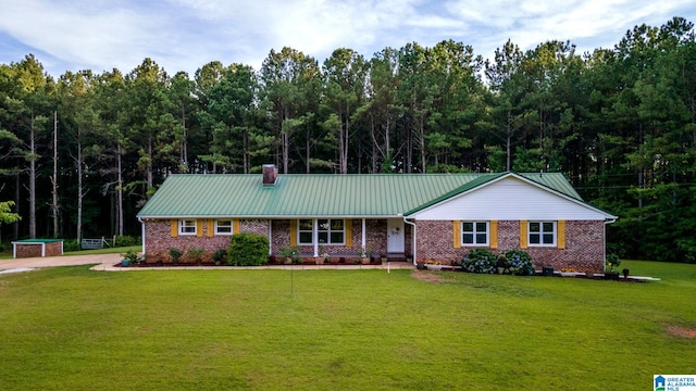 ranch-style home with a front yard