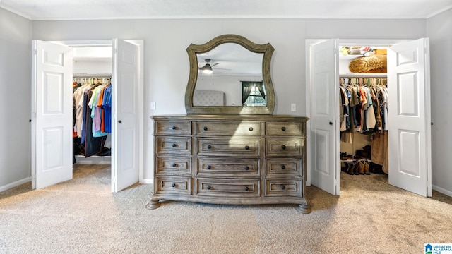 interior space featuring crown molding and light colored carpet