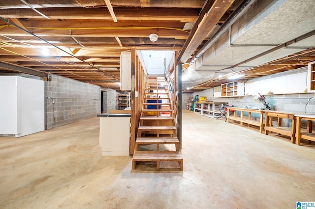 basement featuring white refrigerator