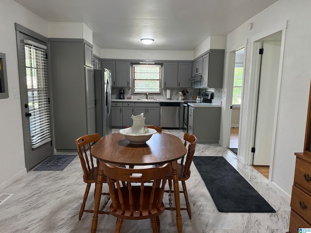 dining room featuring light hardwood / wood-style flooring and sink