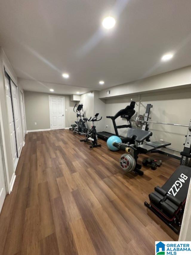 exercise room with hardwood / wood-style flooring