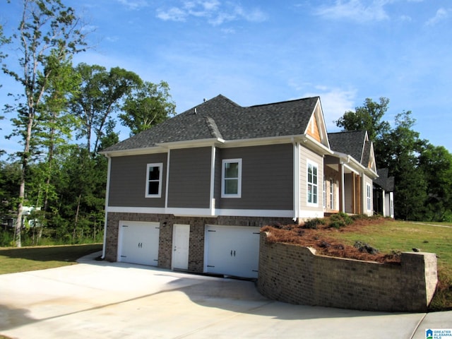 view of property exterior with a lawn and a garage