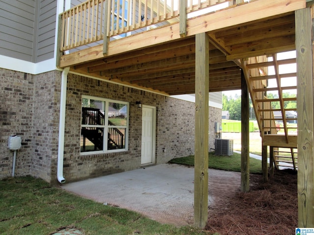 view of patio with central AC and a deck