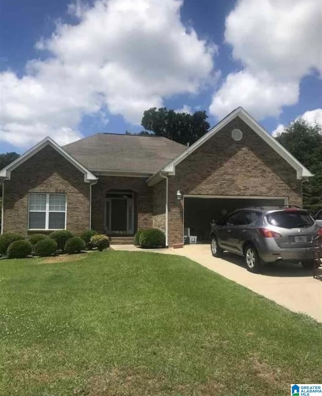 ranch-style home with a garage and a front yard