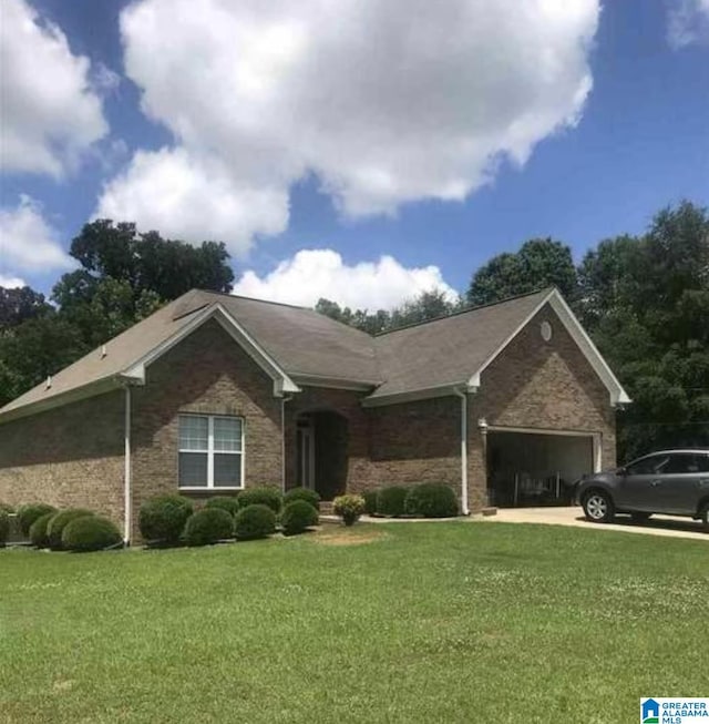 ranch-style house with a garage and a front yard