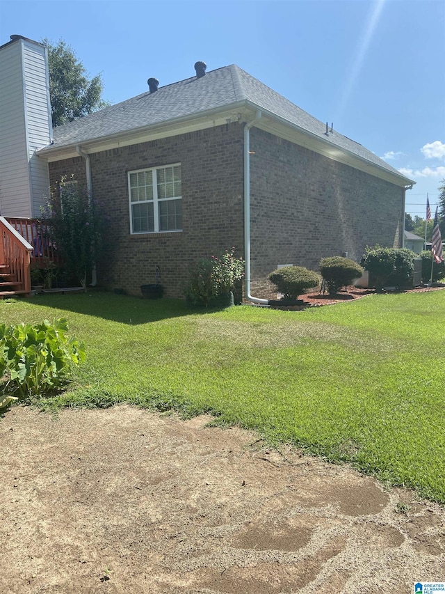 view of home's exterior featuring a yard