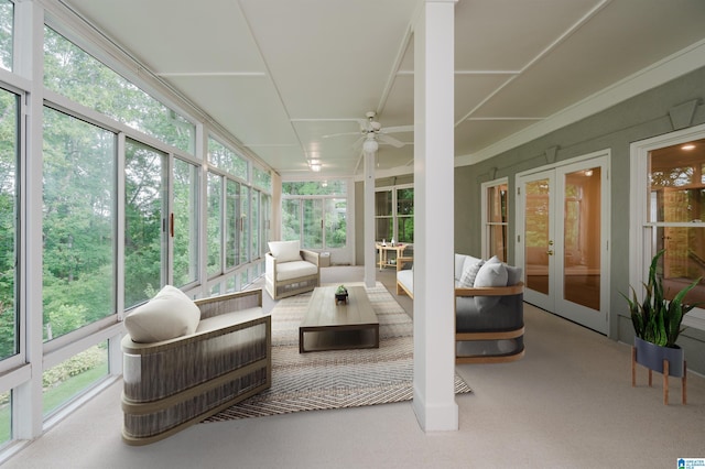 sunroom / solarium with ceiling fan and french doors