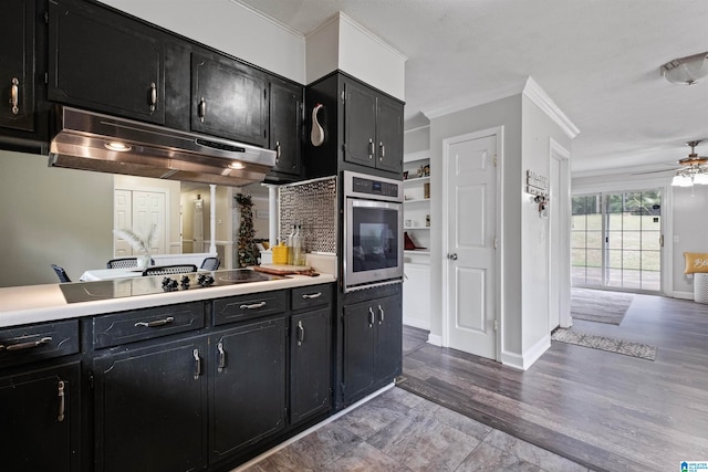 kitchen with stainless steel oven, black electric stovetop, wood-type flooring, ceiling fan, and ornamental molding