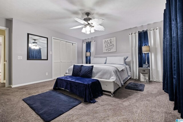 carpeted bedroom featuring ceiling fan and a closet