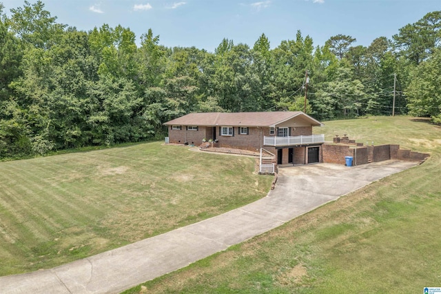 view of front of house with a front yard and a deck