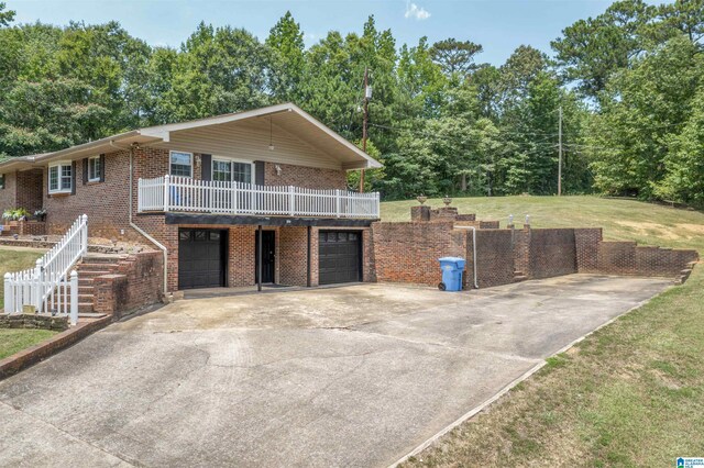 view of front facade with a garage and a front lawn