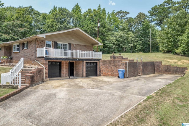 view of front of home featuring a garage and a front lawn