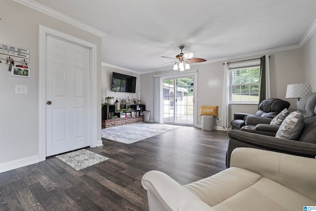 living room featuring hardwood / wood-style flooring, ornamental molding, and ceiling fan