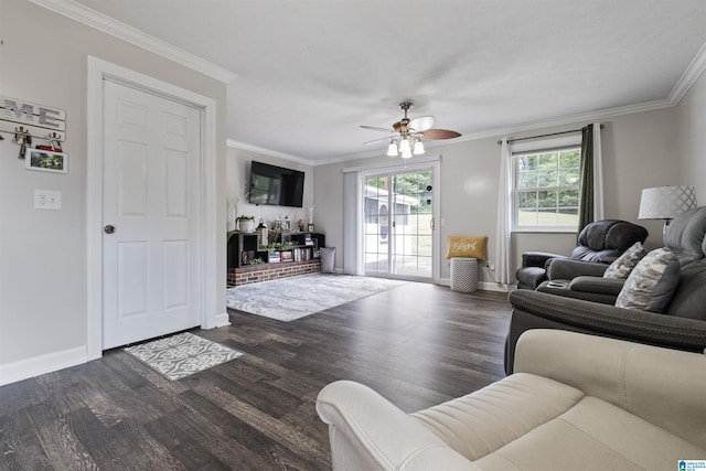 living room with dark wood-type flooring, ornamental molding, and ceiling fan