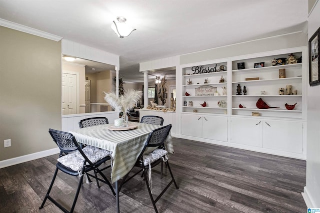 dining space featuring built in shelves, dark hardwood / wood-style flooring, and ornamental molding