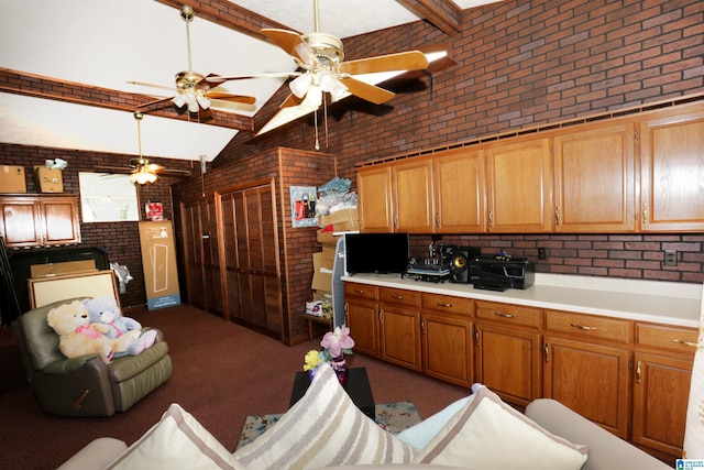 kitchen featuring brick wall and lofted ceiling with beams