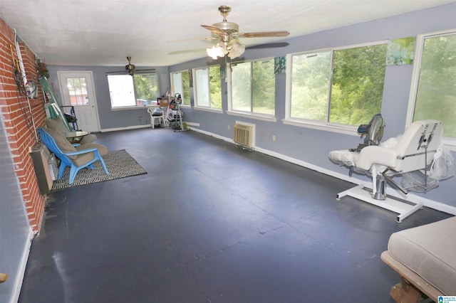 sunroom / solarium with ceiling fan