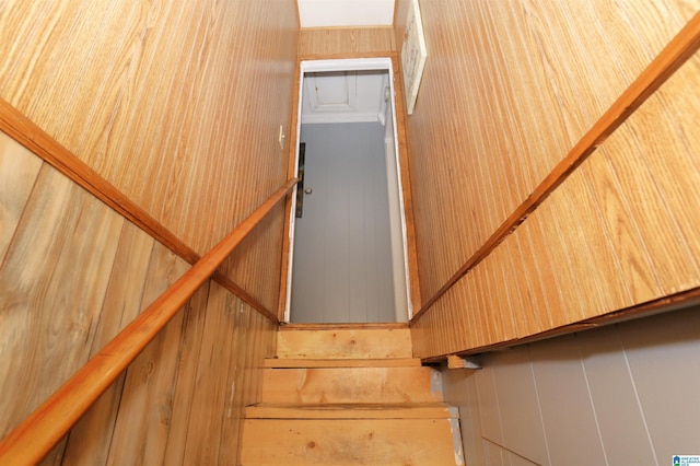 stairway with wood walls