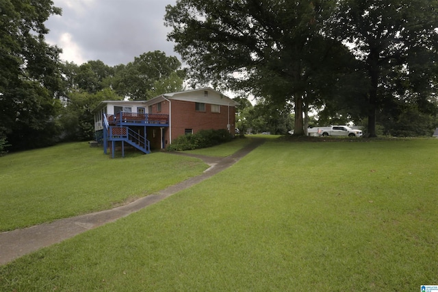 view of yard with a wooden deck