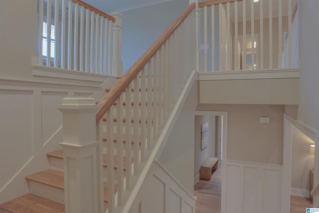 stairs featuring wood-type flooring