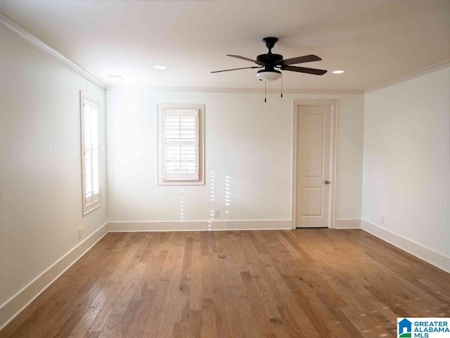 empty room with crown molding, ceiling fan, and light wood-type flooring