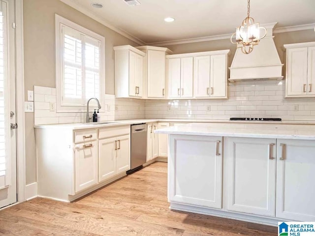 kitchen featuring white cabinetry, hanging light fixtures, and light hardwood / wood-style floors