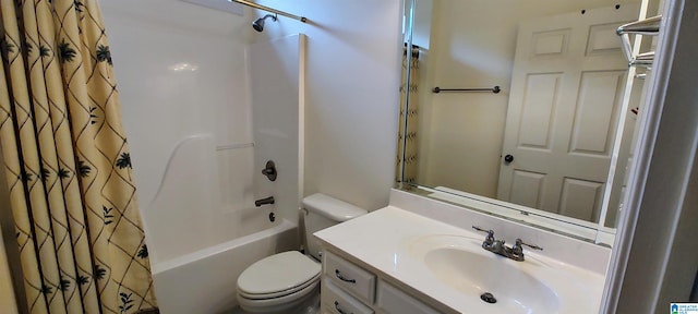 full bathroom with vanity, shower / tub combo, and toilet