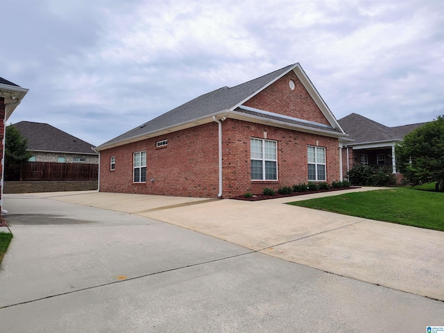 view of home's exterior featuring a lawn