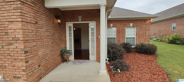 doorway to property with a yard