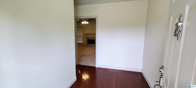 hallway with dark colored carpet