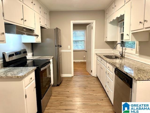 kitchen featuring white cabinets, sink, and stainless steel appliances