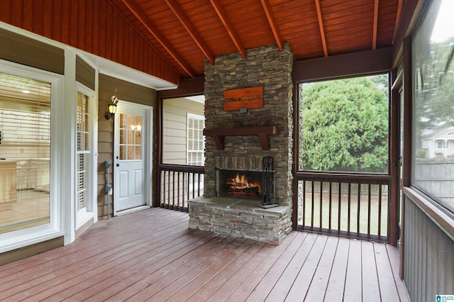 wooden deck with a fireplace