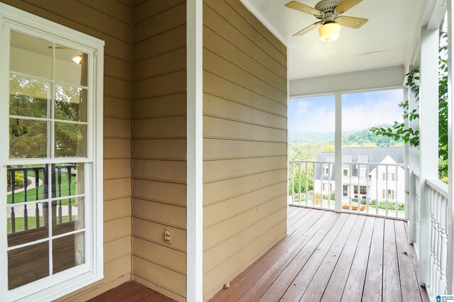 exterior space featuring ceiling fan