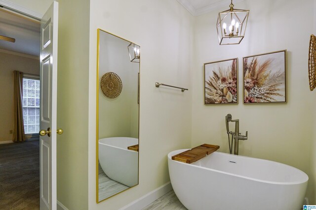 bathroom with crown molding and a tub to relax in