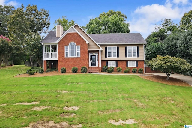 bi-level home with a front lawn