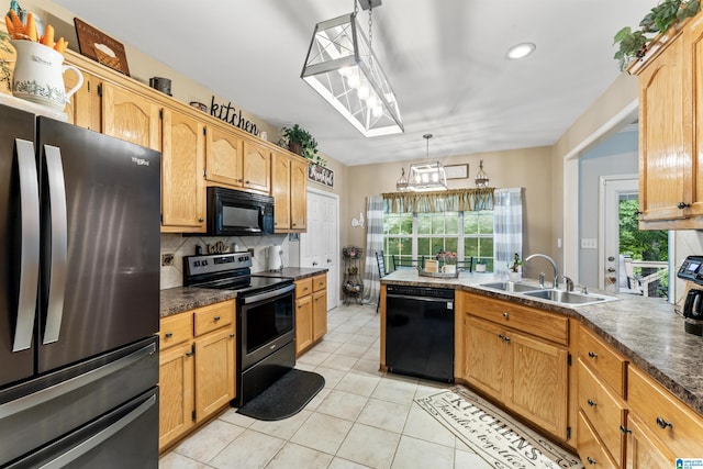 kitchen featuring black appliances, decorative backsplash, sink, hanging light fixtures, and light tile patterned floors