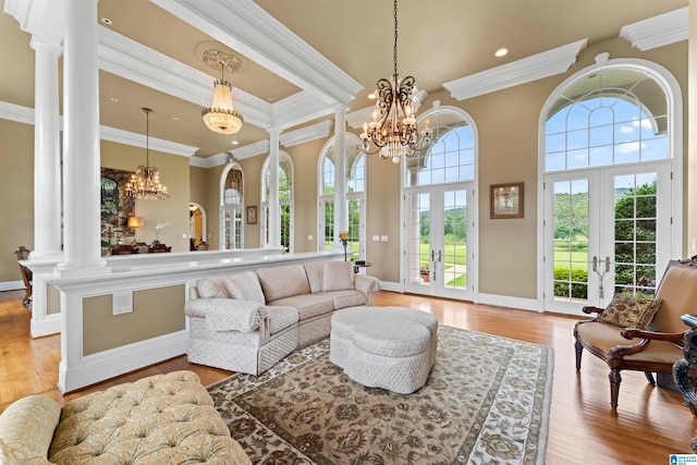 living room featuring light hardwood / wood-style floors, french doors, and plenty of natural light