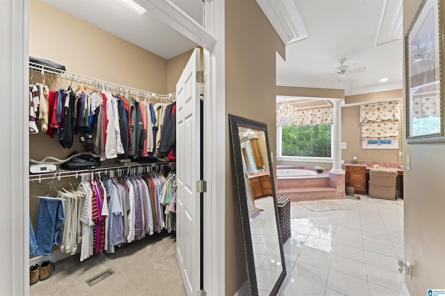 spacious closet featuring ceiling fan and light tile patterned floors