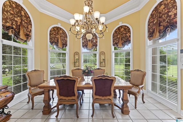 tiled dining room featuring a notable chandelier, crown molding, and plenty of natural light
