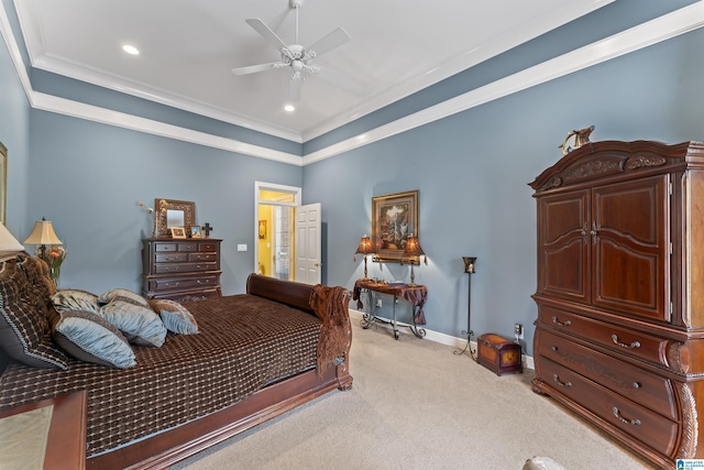 carpeted bedroom with ceiling fan and ornamental molding