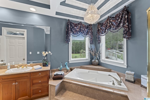 bathroom with tiled tub, vanity, and an inviting chandelier