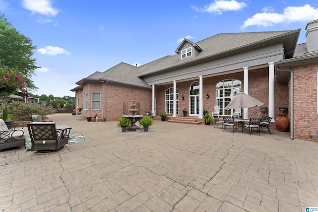 rear view of house with a patio area