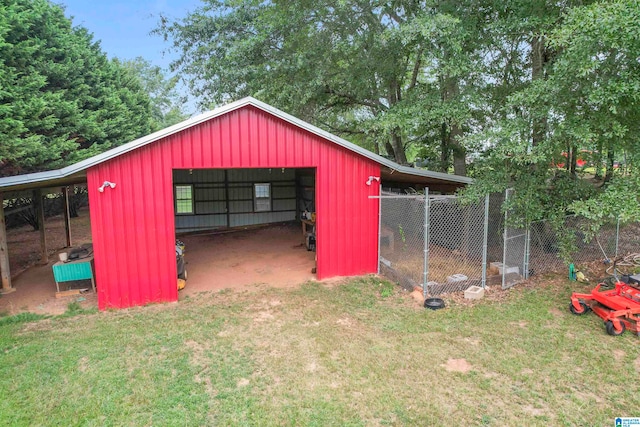 view of outdoor structure featuring a lawn