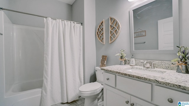 full bathroom featuring tile patterned floors, vanity, toilet, and shower / bath combination with curtain