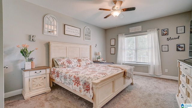 bedroom with ceiling fan and light colored carpet