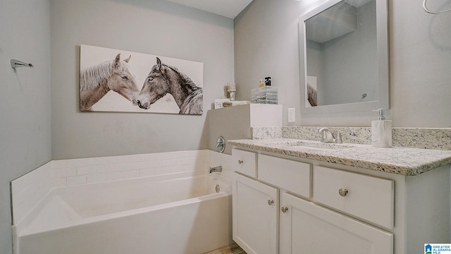 bathroom featuring vanity and a bathing tub