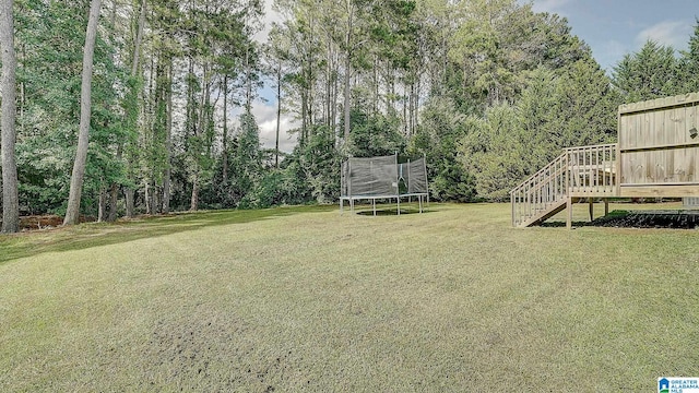 view of yard with a trampoline